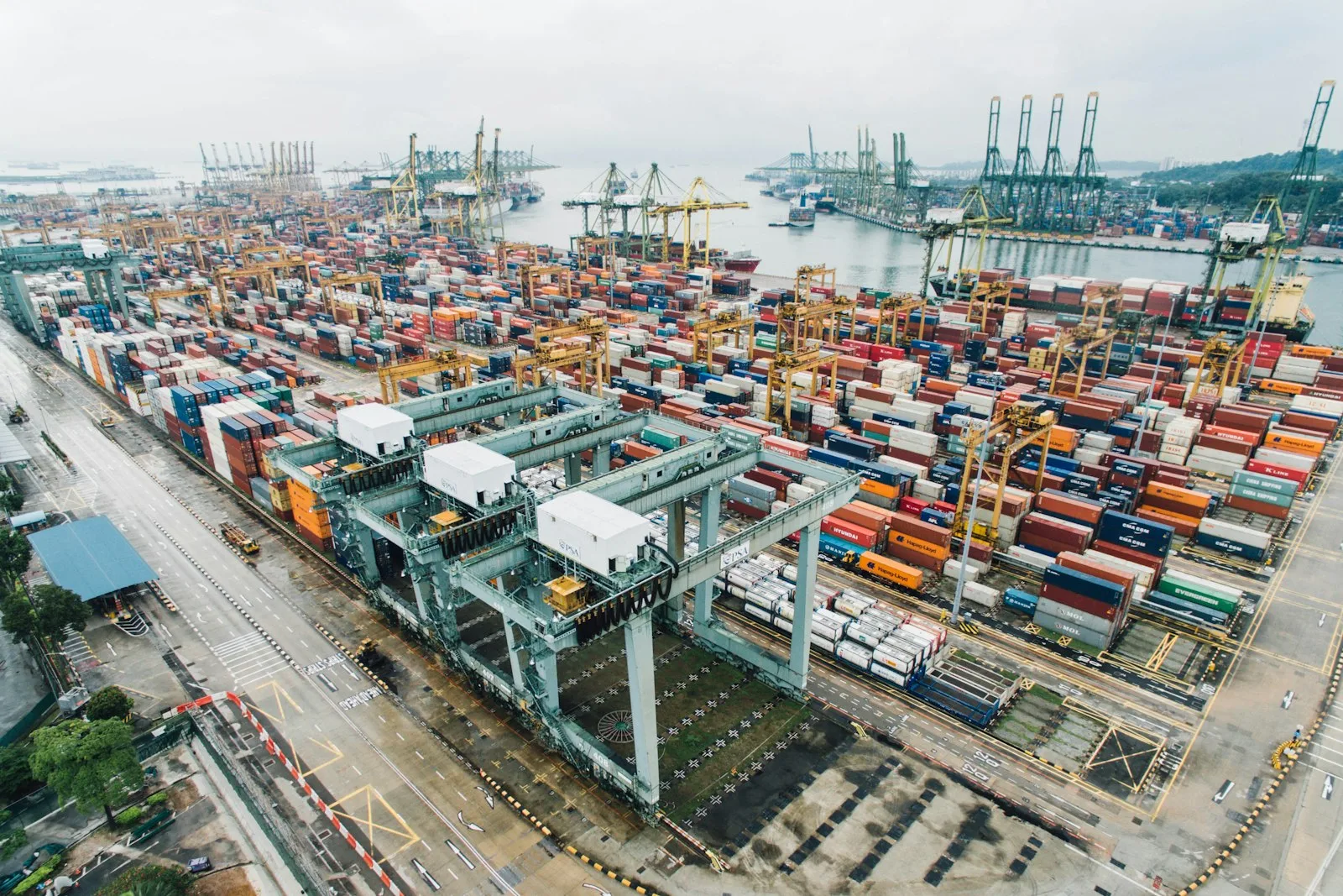 Aerial view of a container port with stacked freight containers